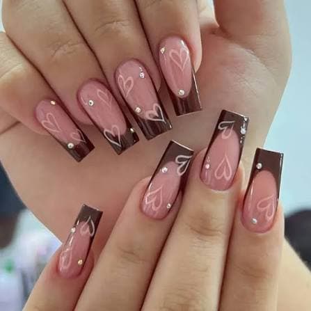 Chocolate brown French tip with heart designs and rhinestone detail