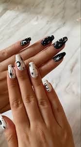Black and white celestial moon and star nail art