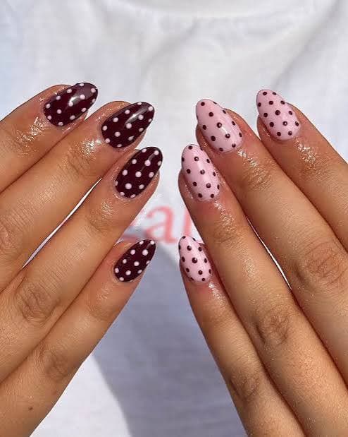 Burgundy and blush pink polka dot nails on almond shape