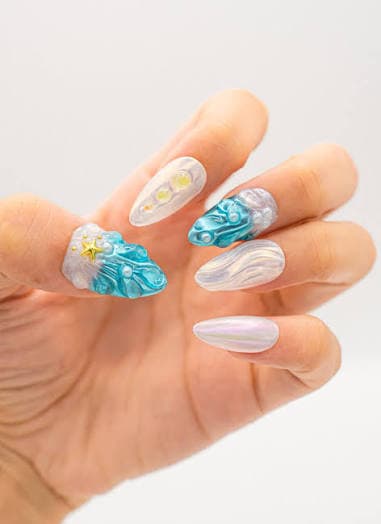 3D textured teal and iridescent pearl nail art